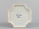 underside view of a porcelain plate with a blue and white design