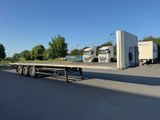 a semi truck that is parked in a parking lot