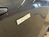 a sticker on the door of a car that says,