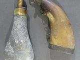 two old light bulbs on a table next to a water faucet