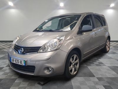 a picture of a silver car parked on a checkered floor