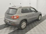 a picture of a silver car parked in a garage