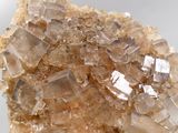 crystals on a piece of rock on a white surface