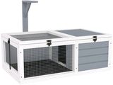 un gros plan d'une cage blanche et grise dont la porte est ouverte