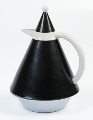 a black and white pitcher with a white handle