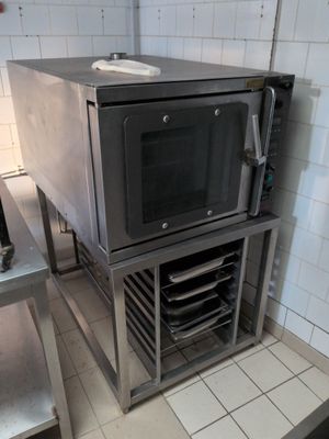an image of a commercial kitchen with a microwave on the counter