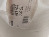 a roll of toilet paper wrapped in a plastic bag
