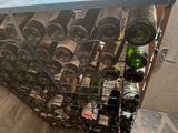 many bottles of wine in a rack on the floor