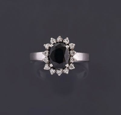 a black diamond and diamond cluster ring