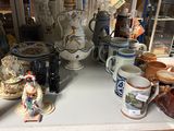 many different types of coffee mugs on the table