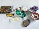 several different types of rocks and stones on a white surface
