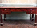 a wooden desk with two drawers on top of it