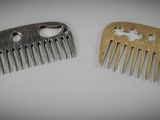two combs sitting next to each other on a table