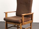 brown upholstered chair with armrest and foot rest