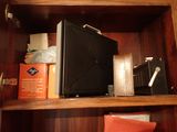 a microwave sitting on top of a shelf in a cabinet