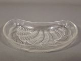 a clear glass bowl with a leaf design on it