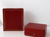 pair of red leather jewelry boxes with gold trim