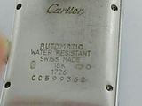a close up of a wrist watch on a white surface