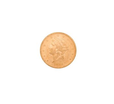 a close up of a gold coin on a white background