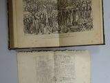 an open book with a picture of a group of people on it