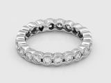 a close up of a diamond ring on a white surface