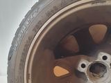 a close up of a tire on a white surface
