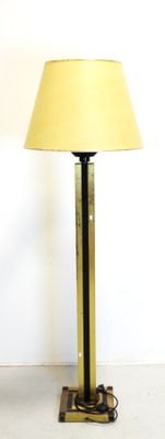 a lamp that is sitting on a table next to a chair