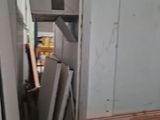 a door that is open in a room with wood flooring