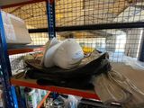 a pile of items on a shelf in a warehouse
