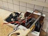 a box of tools sitting on a counter in a kitchen