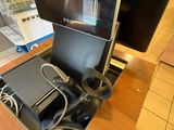 a laptop computer sitting on a desk in a store