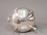 an image of a silver bowl with a fish design on it