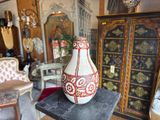 a vase that is sitting on a table in a room