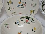 three bowls and a bowl on a white table