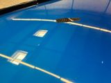 a remote control on the hood of a blue car