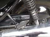 a close up of a motorcycle that is parked on the street