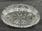 a clear glass bowl with a decorative design on it