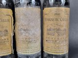 three bottles of wine sitting next to each other on a table