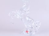 a glass horse that is standing on its hind legs