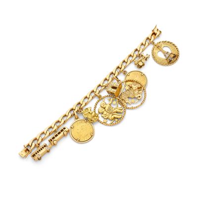 a close up of a gold bracelet with charms on it