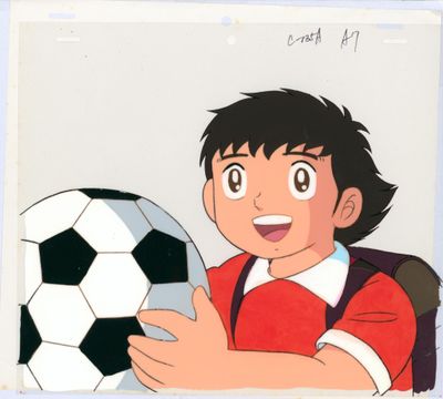 animation production cel of a boy holding a soccer ball