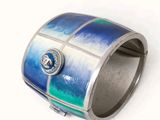 a picture of a blue and green bracelet with a diamond