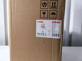 a cardboard box with a sticker on it sitting on a table