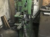 a machine that is sitting in a room next to a stove