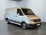 the silver van is parked in a large room with white walls