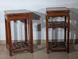 two side tables that are sitting on a tiled floor