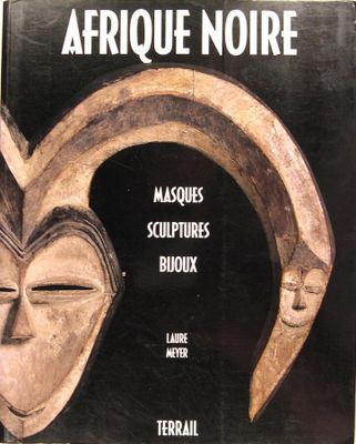 a book with a picture of a mask on it