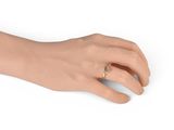 a close up of a person ' s hand with a ring on it