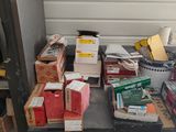 many boxes and boxes on a table in a garage