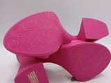 pink high heeled shoes with bows and bows on the toes